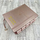 NLT INSPIRE CATHOLIC BIBLE (BIBLIA EN INGLES) ROSE GOLD (With tabs and crown charm)